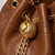 Prysm 1 Brown — Geantă tip sac din piele naturală cu lanț