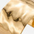 Close-up of the gold-tone hammered cuff bracelet texture